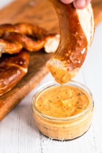Aztec Sauce - southwest sauce in glass jar with pretzel dipping into it