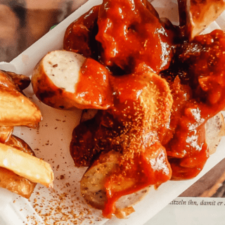 currywurst with fries in a tray