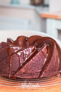 chocolate bundt cake with chocolate ganache on wire rack